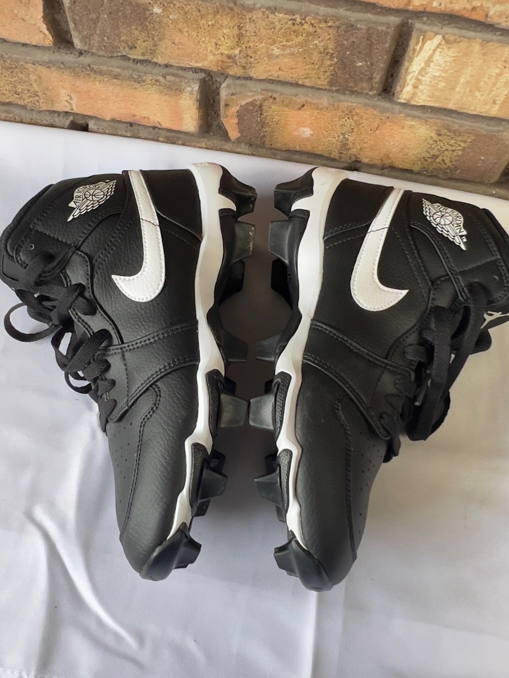 Nike Kids Black and White Cleats with White Swoosh